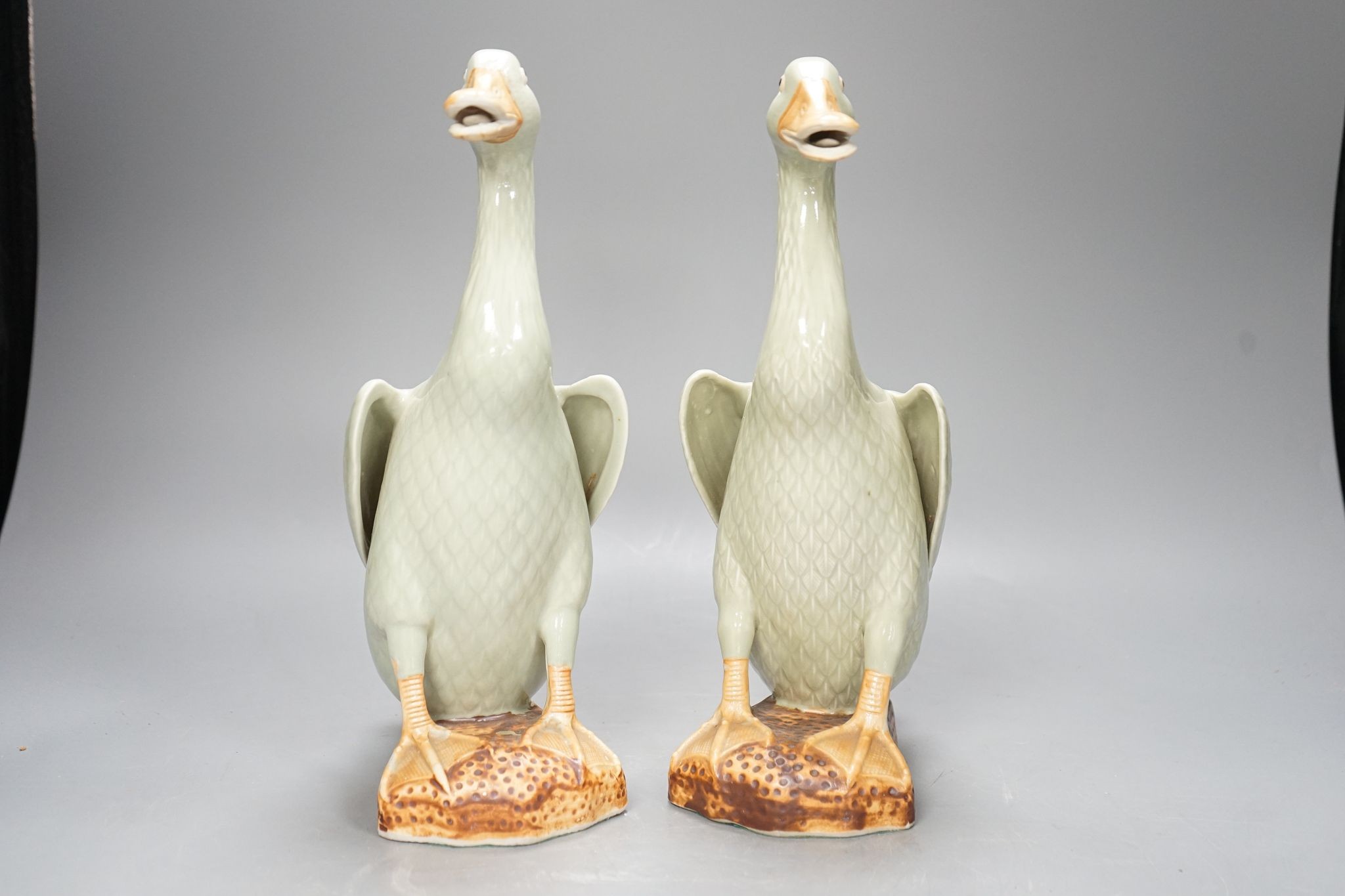 A pair of Chinese celadon glazed geese, 30cm